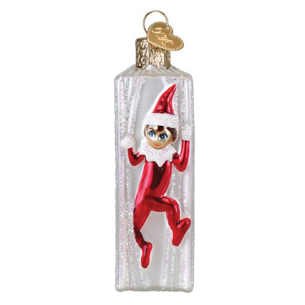 Spine view of the Elf on the Shelf ornament with the red suited elf climbing over the edge