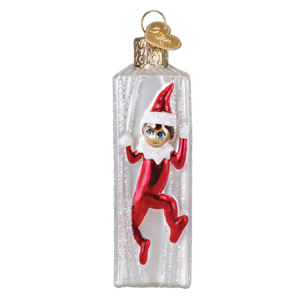 Spine view of the Elf on the Shelf ornament with the red suited elf climbing over the edge