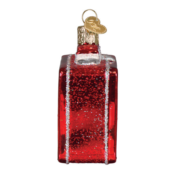 Side view of the red lunchbox ornament with glittered silver trim along the edges