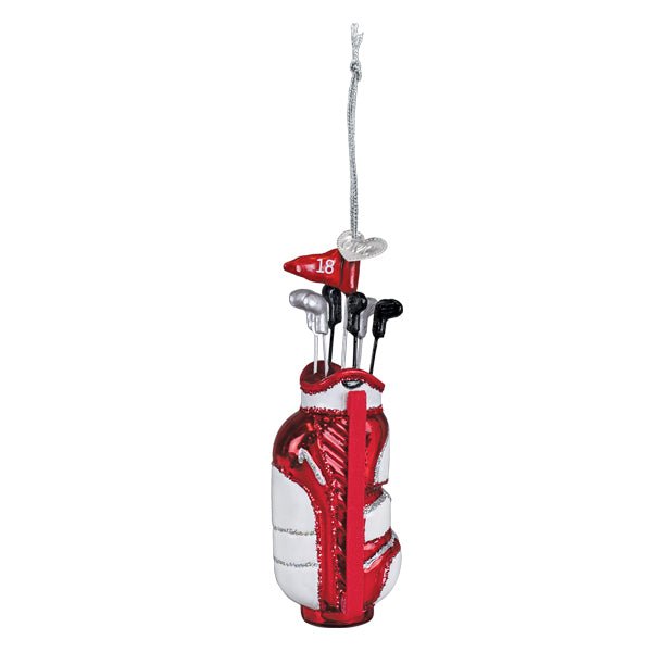 Red and white golf bag glass ornament with clubs and a red pin flag, hanging from a silver cord on white