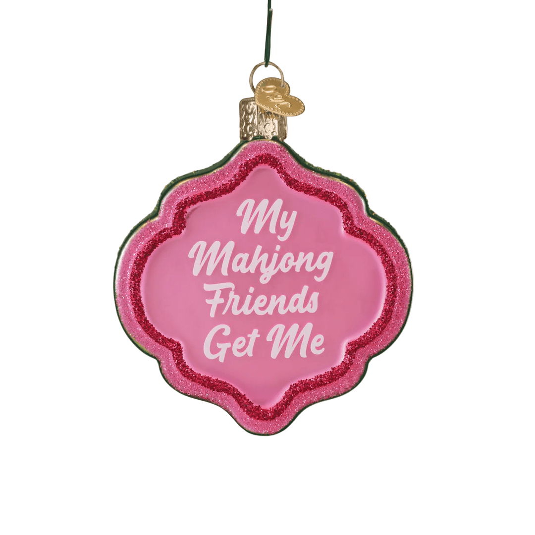 Decorative ornament with 'My Mahjong Friends Get Me' text on a Christmas tree.