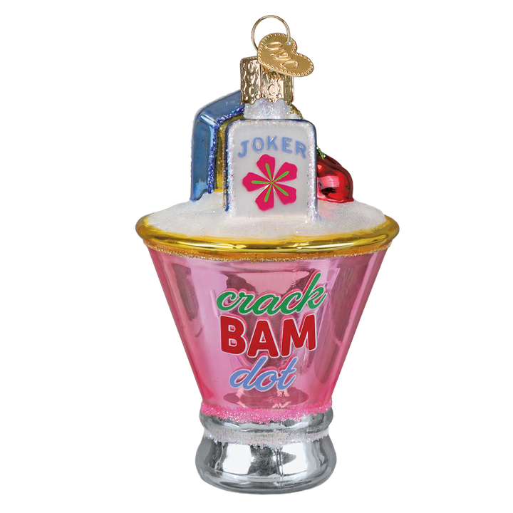 Pink martini glass ornament with a Joker mahjong tile, cherry, and Crack Bam Dot lettering, front view on white