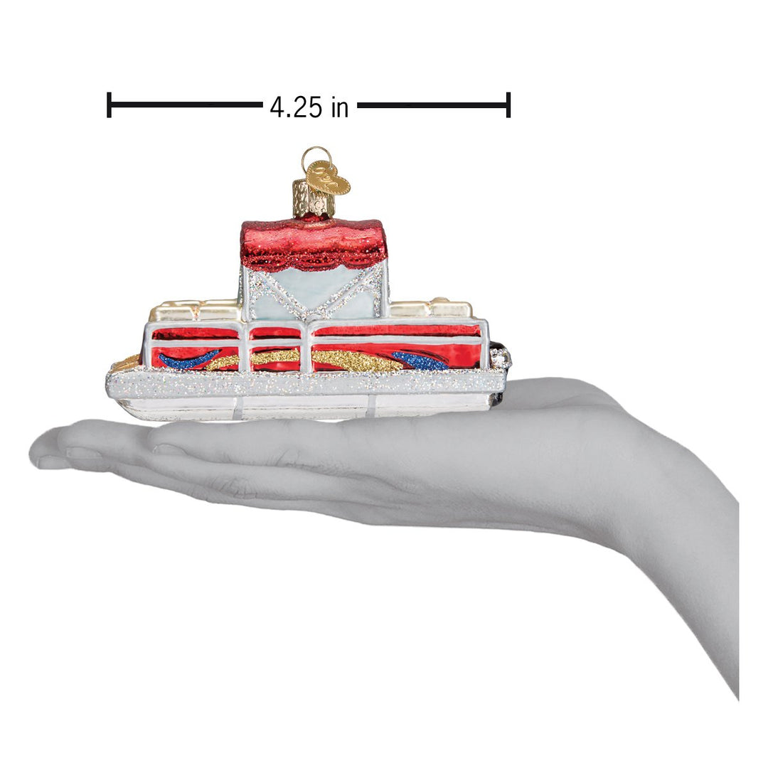 Pontoon boat ornament resting on an open palm under a 4.25 inch length marker