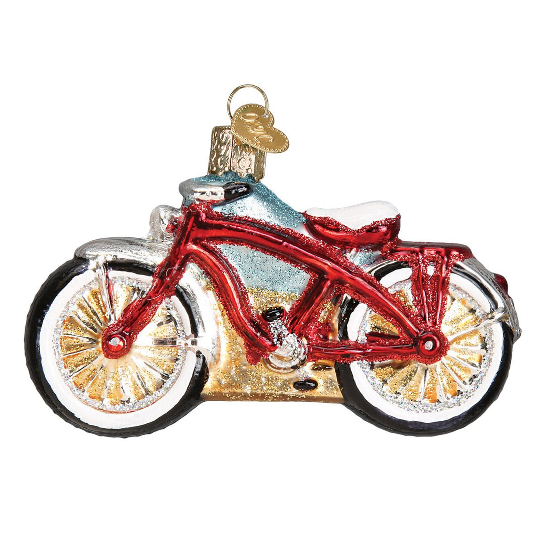 Opposite side of the red cruiser bike ornament showing the chain side and gold spokes, on white