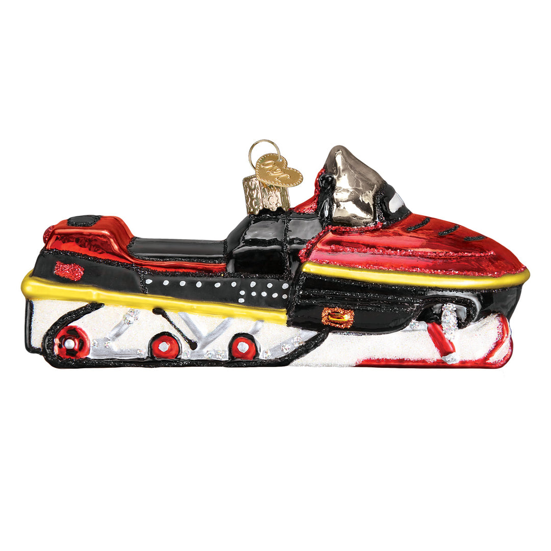 Other side of the snowmobile ornament showing the red track wheels, on white