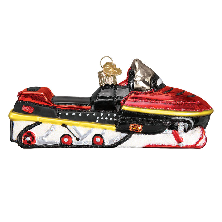 Other side of the snowmobile ornament showing the red track wheels, on white