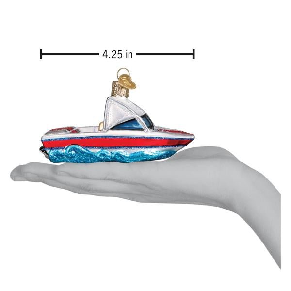 Ski boat ornament resting on an open palm under a 4.25 inch length marker