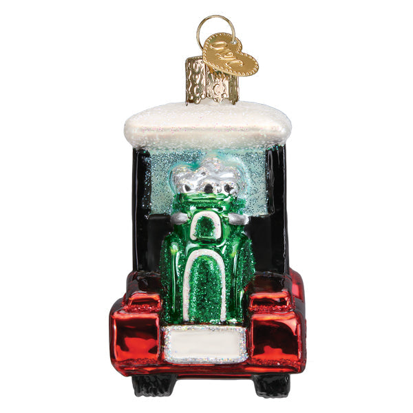 Rear view of the red golf cart ornament with the green golf bag strapped on back, on white
