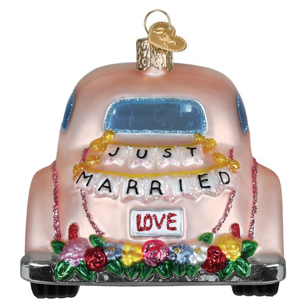 Blush pink vintage car ornament with a Just Married banner, LOVE plate, and flowers on the bumper, rear view