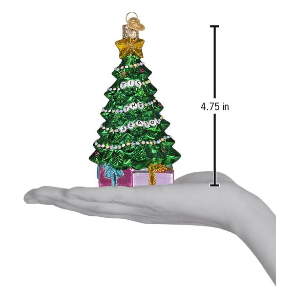 Friendship tree ornament on an open palm beside a 4.75 inch height marker