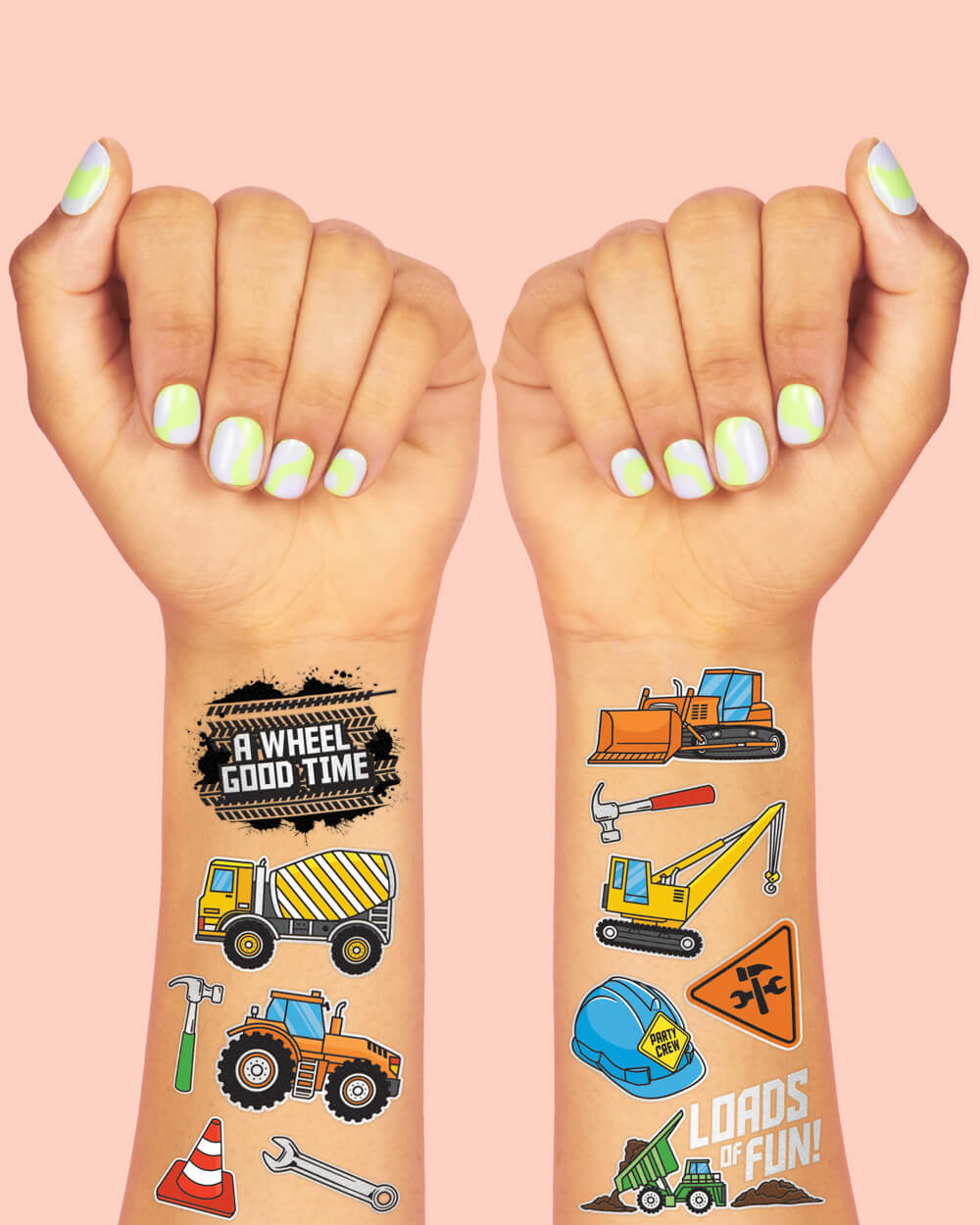 Construction temporary tattoos on two wrists showing a dump truck, digger, and road sign art