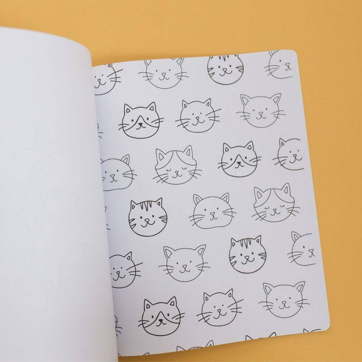 Coloring page of rows of cat faces inside the Cat Lover coloring book, an easy quiet-time activity