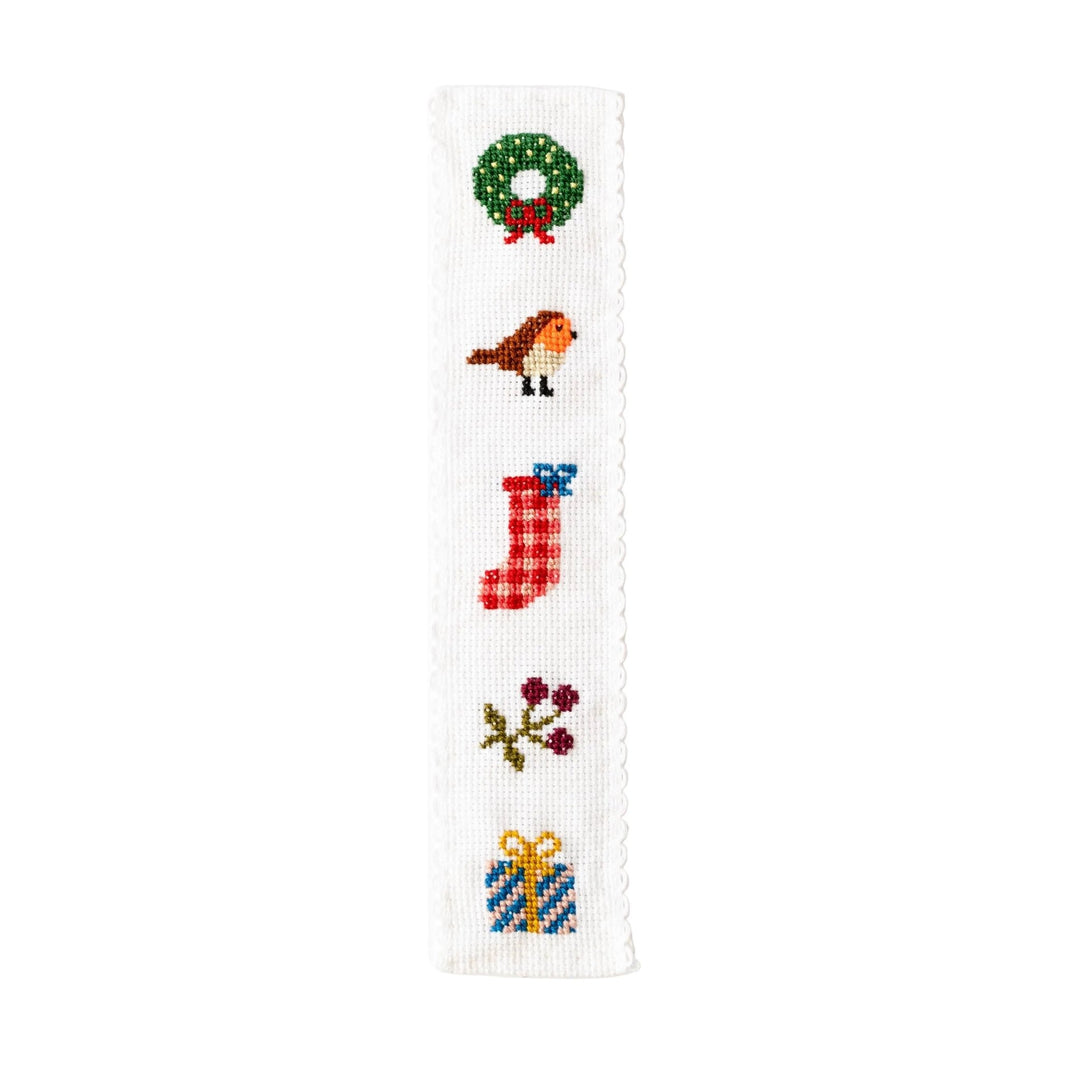 Christmas cross stitch bookmark with wreath, robin, stocking, berries, and present