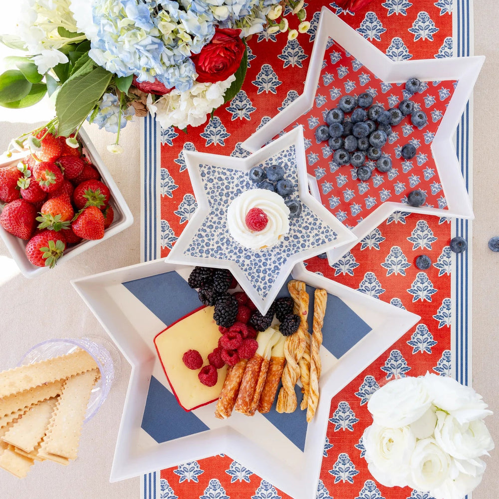 Red, white, and blue bamboo trays on a summer Fourth of July tablescape