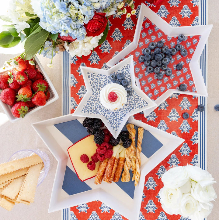 Red, white, and blue bamboo trays on a summer Fourth of July tablescape
