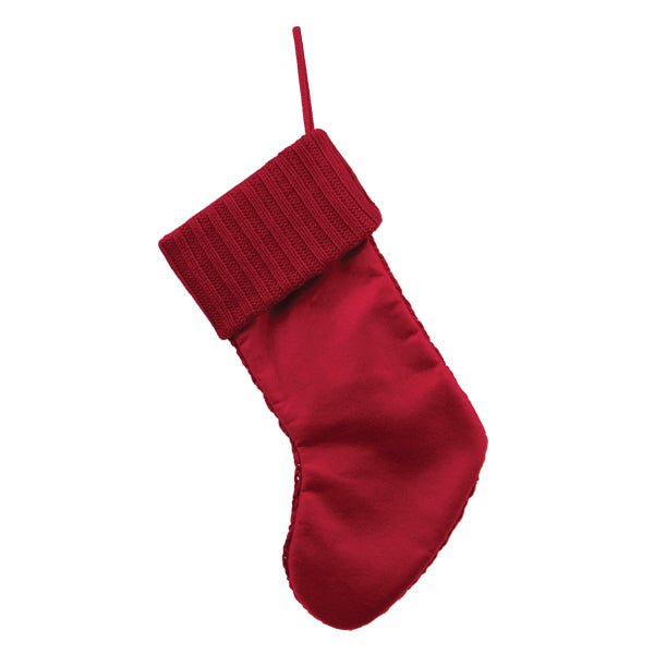 Back of the red knit stocking showing the smooth red backing and cuff, on white