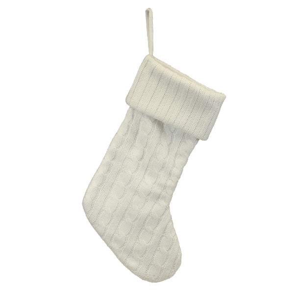 Front of the white plush cable knit Christmas stocking with a fold-over cuff and hanging loop, on white