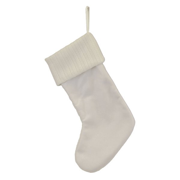 Back of the white cable knit stocking showing the smooth plush backing and cuff, on white