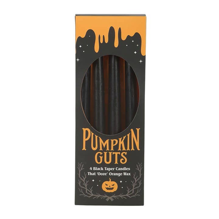 Pumpkin Guts box of four black taper candles that ooze orange wax, playful decor for a Halloween party