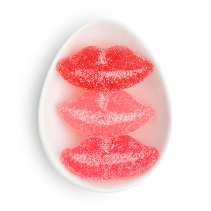 Ceramic tile with red lips sour candy design on a white background