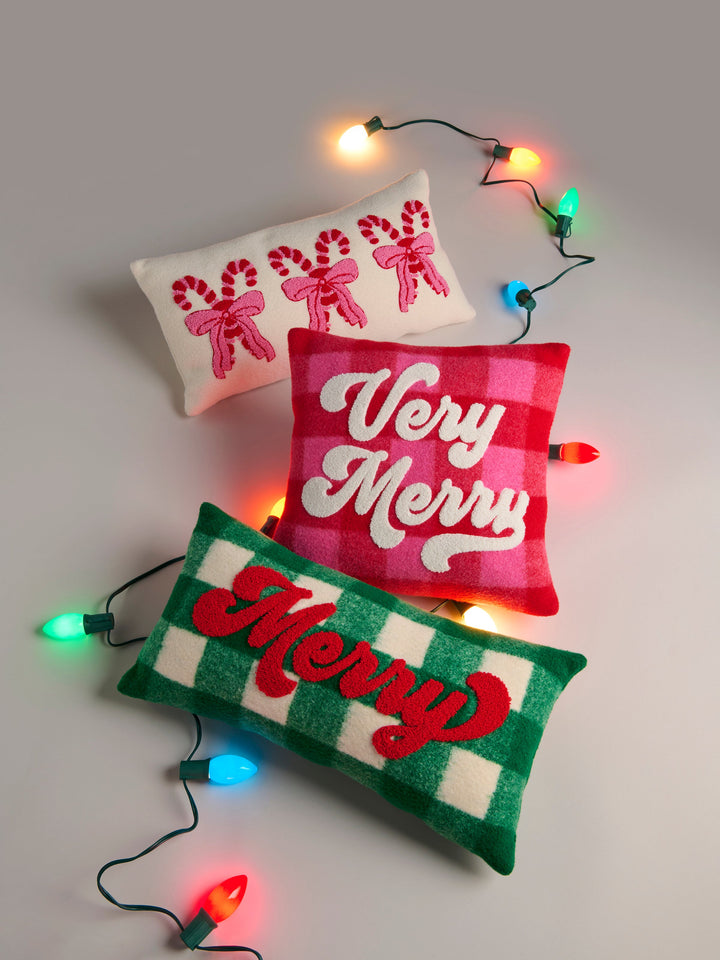 Green Merry pillow with Very Merry pillows and string lights