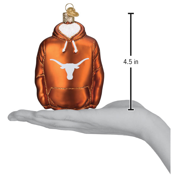 Texas Longhorns hoodie ornament on an open hand with a 4.5 inch scale marker beside it