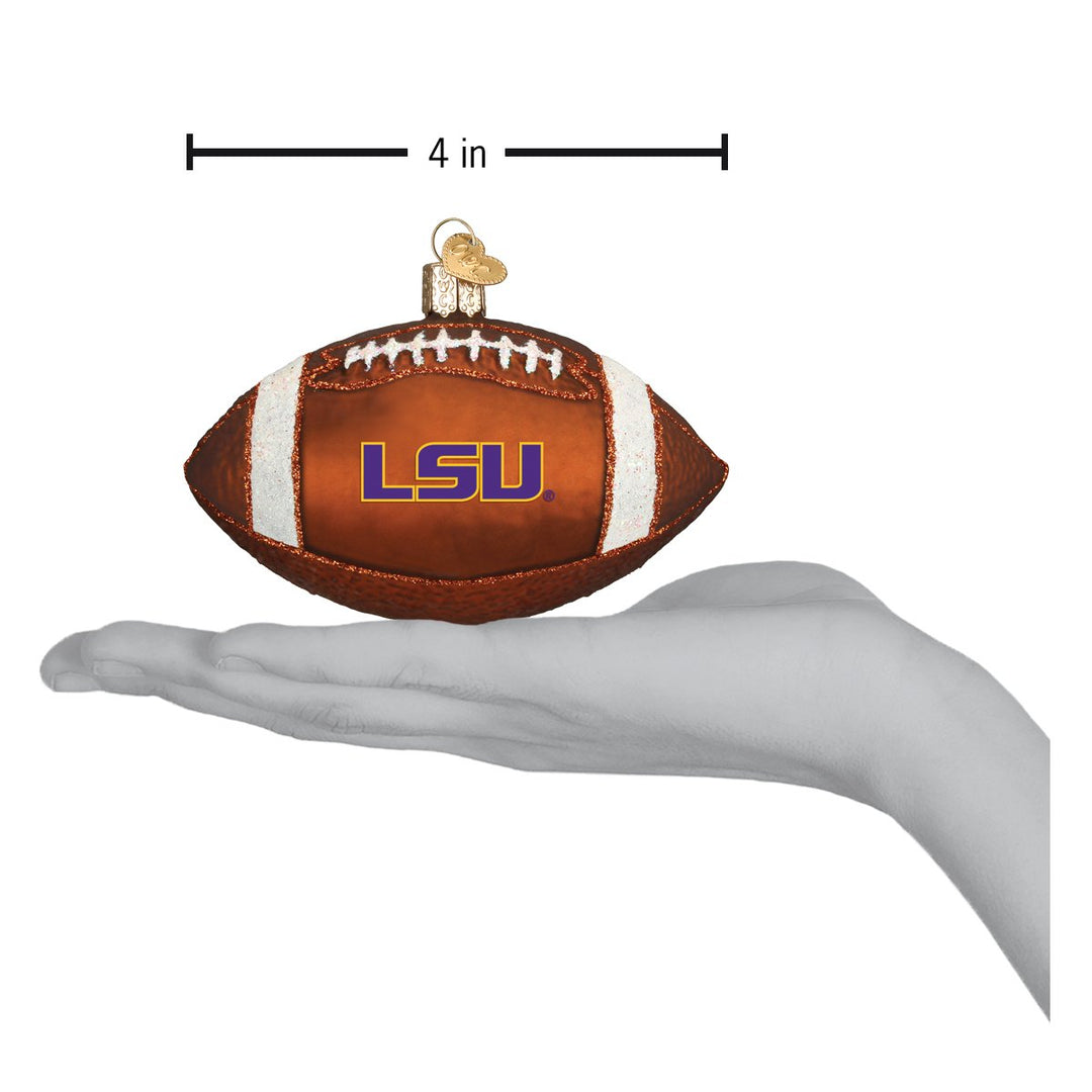 LSU football ornament on an open hand with a 4 inch width marker for scale