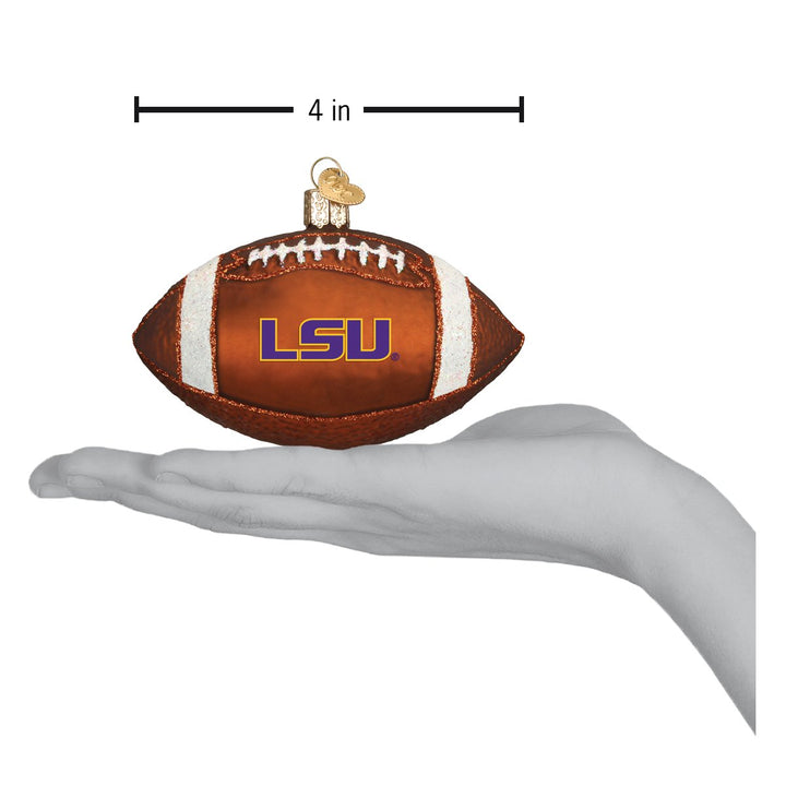 LSU football ornament on an open hand with a 4 inch width marker for scale