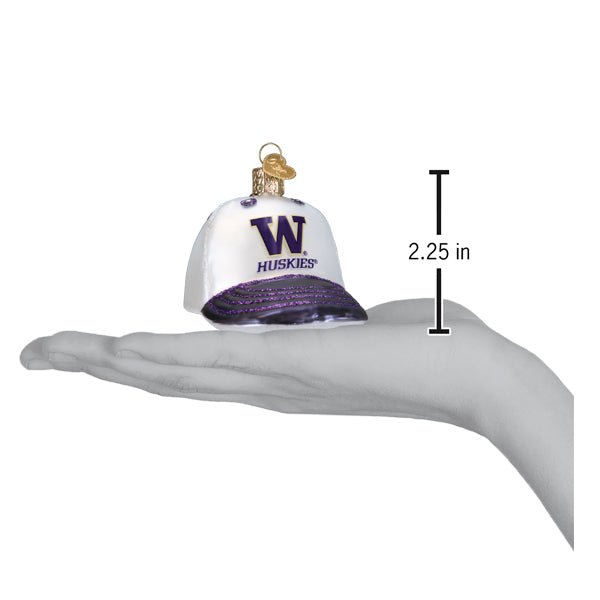Washington cap ornament on an open palm beside a 2.25 inch height marker