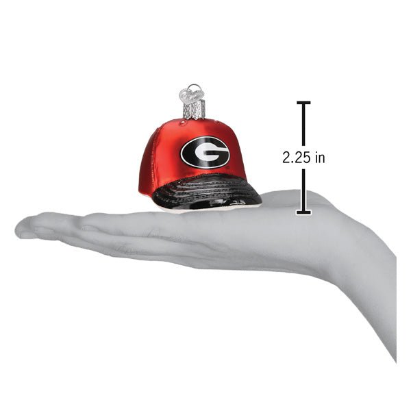 Georgia cap ornament on an open palm beside a 2.25 inch height marker