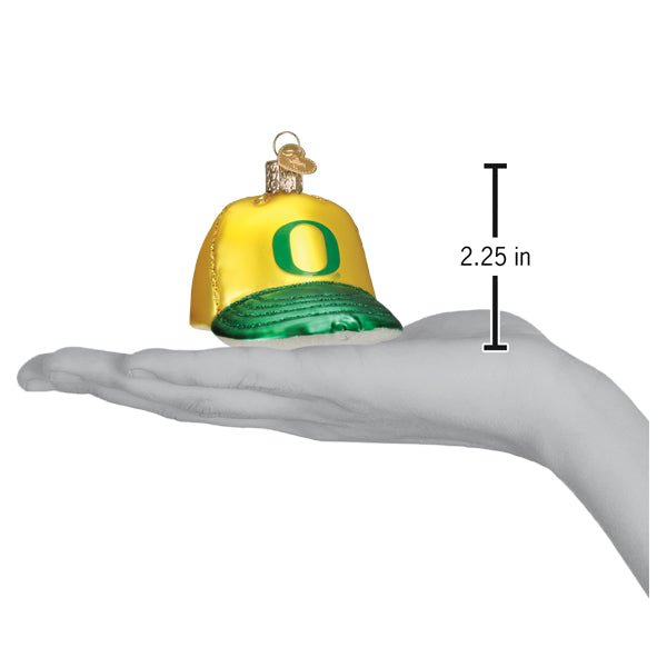 Oregon cap ornament on an open palm beside a 2.25 inch height marker