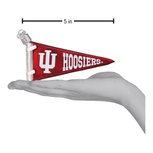 Indiana pennant ornament resting on an open hand with a 5 inch length marker for scale