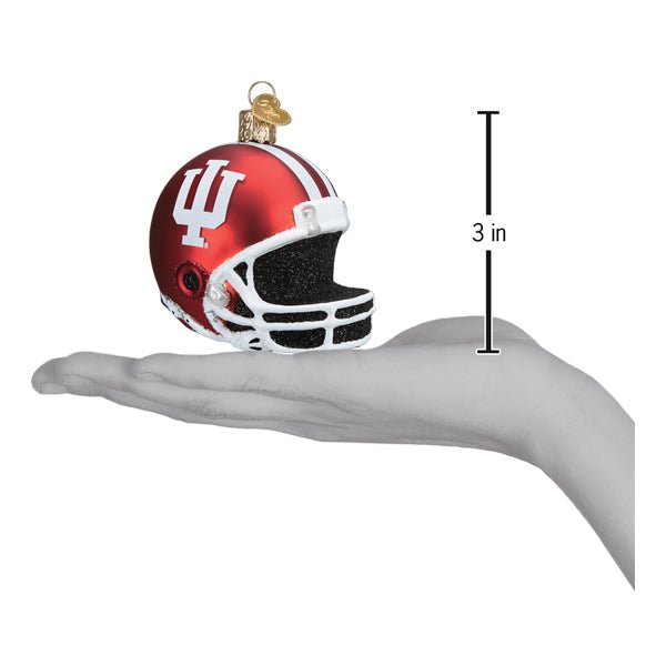 Indiana football helmet ornament on an open hand with a 3 inch height marker for scale