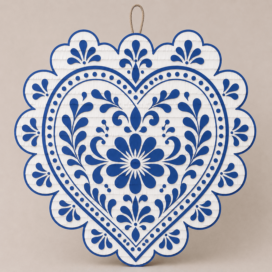 Scalloped heart piñata in cobalt blue and white Talavera-inspired florals, a folk art centerpiece for a wedding