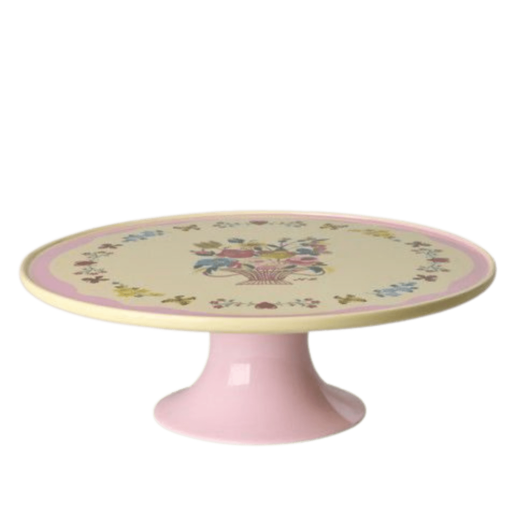 Low pink melamine cake stand with Nathalie Lété flower basket print on a cream top and pink pedestal, side view