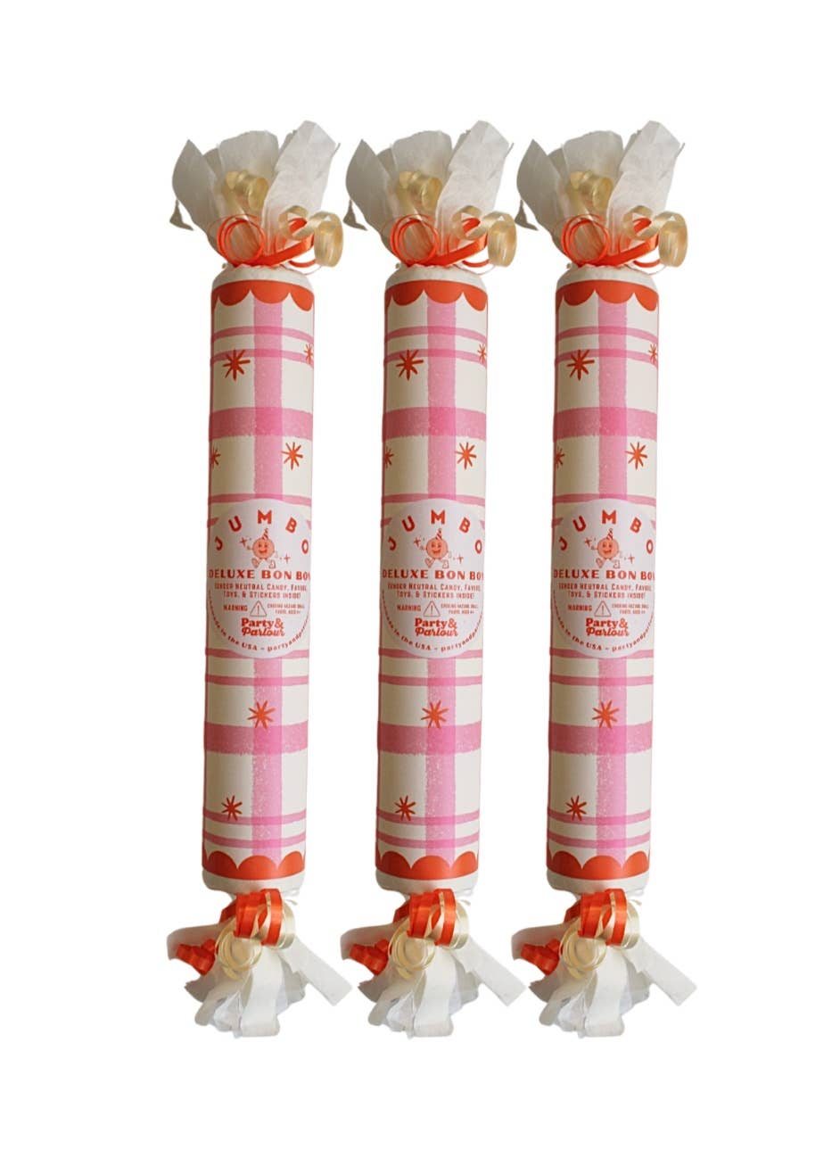 Three pink plaid jumbo surprise bon bons with cream fringe and orange ribbon for pink party themes