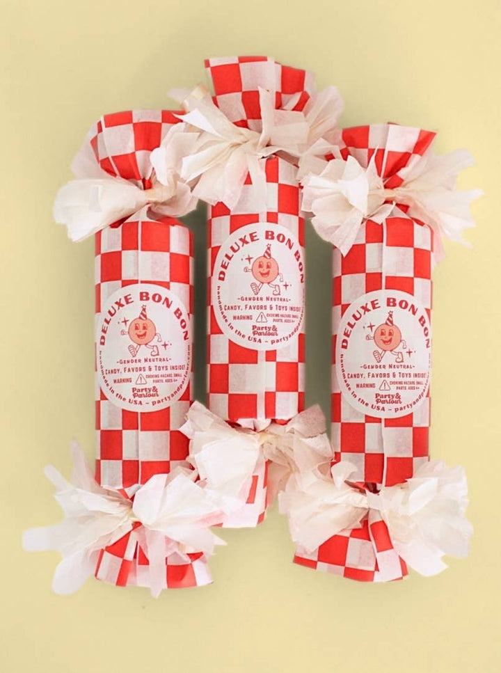 Red and white check bon bon trio on a yellow background, styled for carnival birthday themes