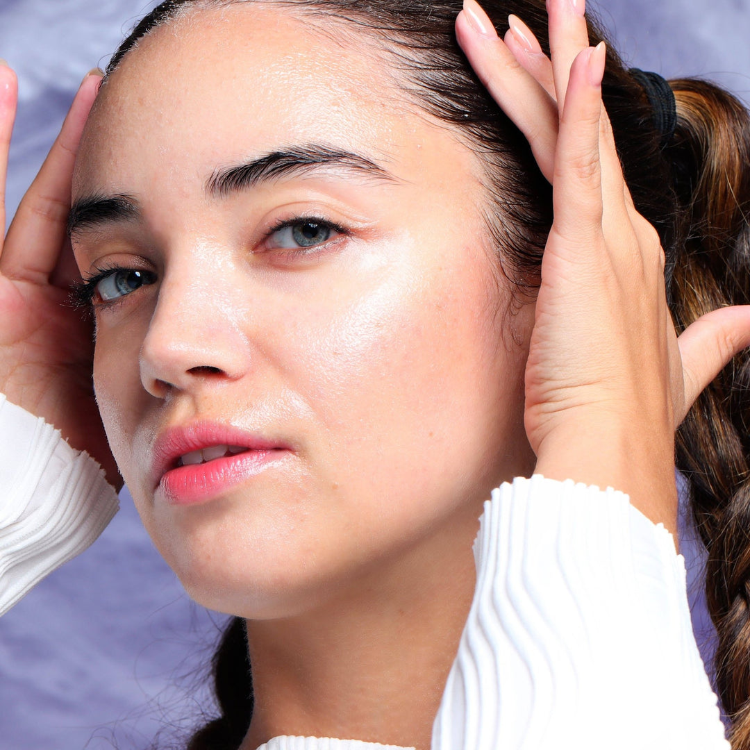 Model showing fresh glowing skin after using the pore refining mummy mask, a Halloween self care payoff