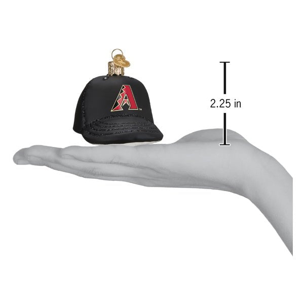 Diamondbacks baseball cap ornament resting on an open palm beside a 2.25 inch height marker
