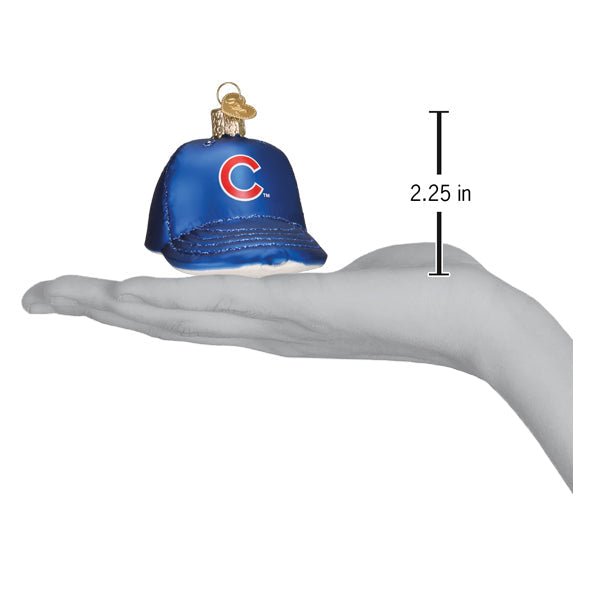 Cubs baseball cap ornament resting on an open palm beside a 2.25 inch height marker