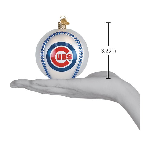 Cubs baseball ornament resting on an open palm beside a 3.25 inch height marker