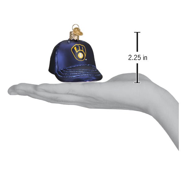 Brewers baseball cap ornament resting on an open palm beside a 2.25 inch height marker