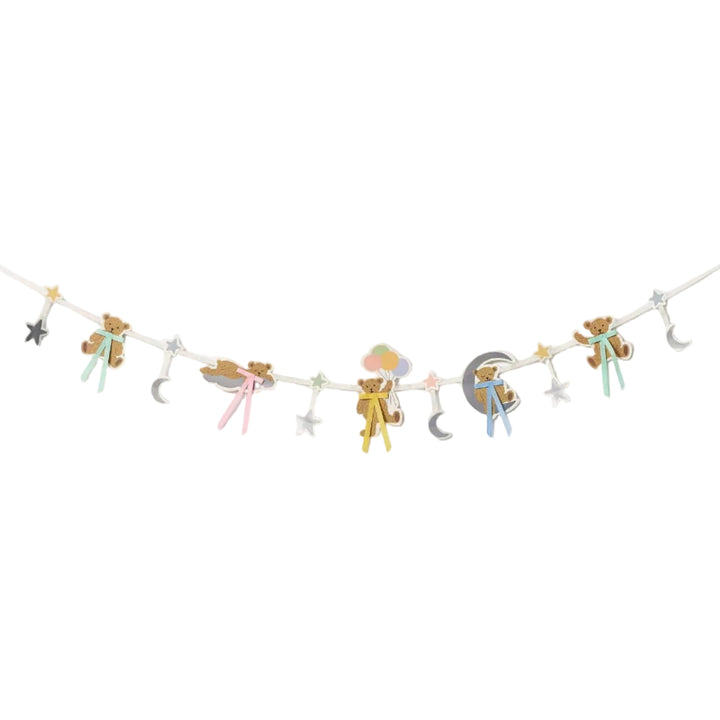 Sweet Little One garland strung with teddy bears, pastel bows, silver stars, and moons for a baby shower