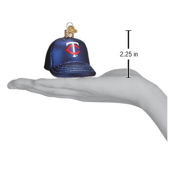 Twins baseball cap ornament resting on an open palm beside a 2.25 inch height marker
