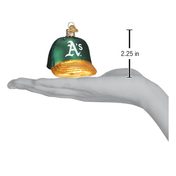 Athletics baseball cap ornament resting on an open palm beside a 2.25 inch height marker