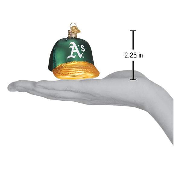 Athletics baseball cap ornament resting on an open palm beside a 2.25 inch height marker