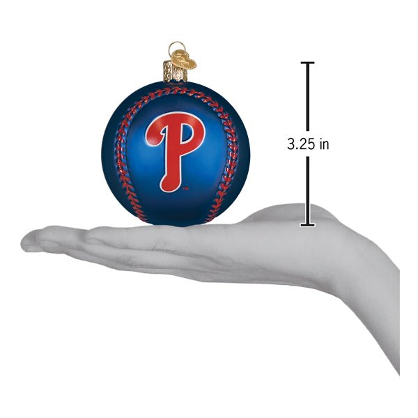 Phillies baseball ornament resting on an open palm beside a 3.25 inch height marker