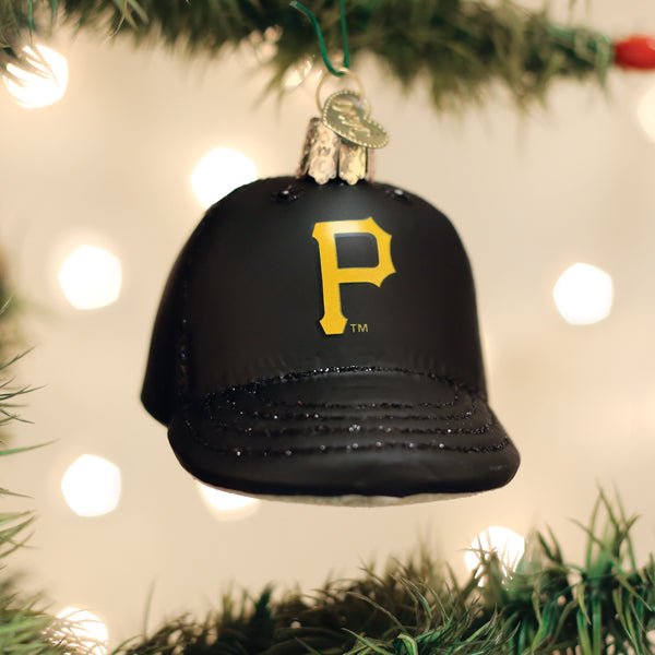 Pirates cap ornament hanging on a lit Christmas tree with warm glowing bokeh lights behind