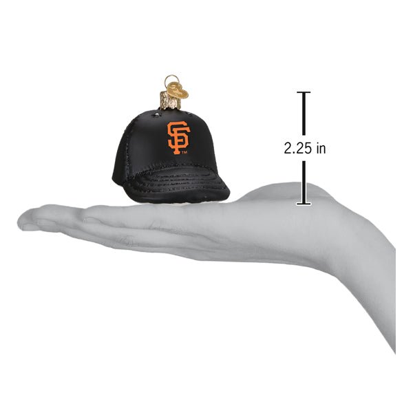 Giants baseball cap ornament resting on an open palm beside a 2.25 inch height marker