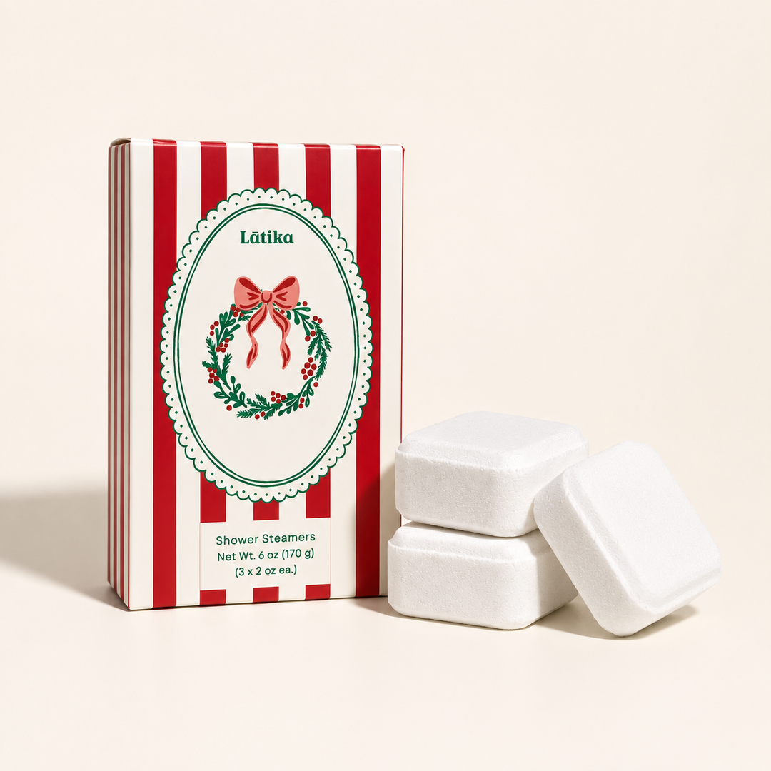 Red striped Latika box with wreath crest and three white shower steamers, a pine and cedarwood stocking stuffer